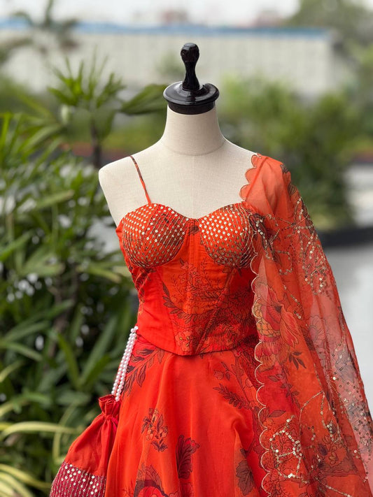 Elegant Orange Color Organza Lehenga Choli Set With Designer Batwa