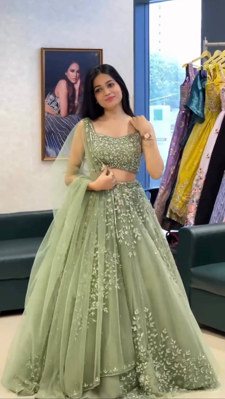 Pista Green Soft Butterfly Net Heavily Embroidered Lehenga Choli Set