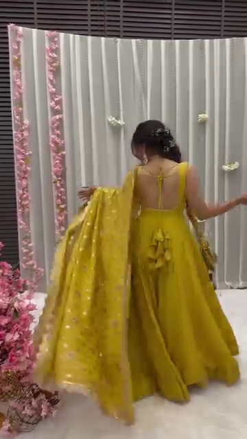 Mustard Yellow Solid Flared Gown Set with Gota Tassels and Banarasi Dupatta